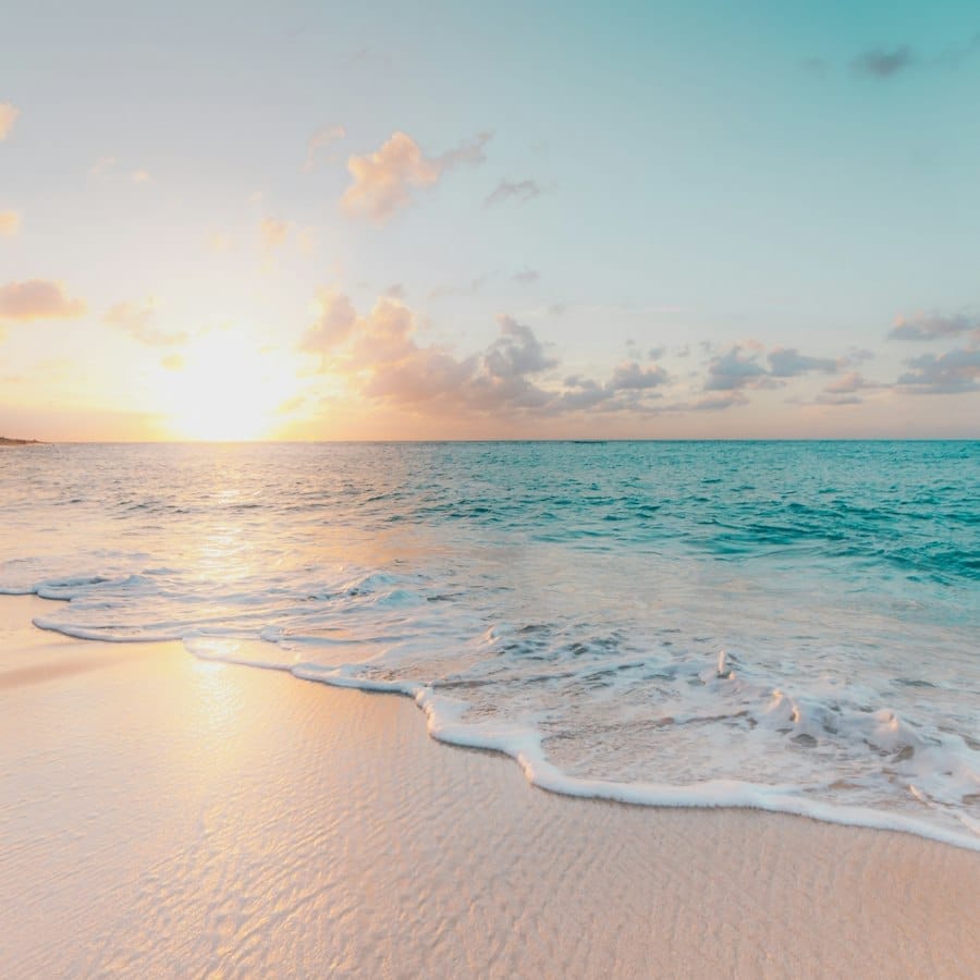 Sunset over a quiet tropical beach.